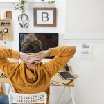 Modern creative man relaxing on workspace.