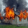 house on fire, flames out windows, smoke