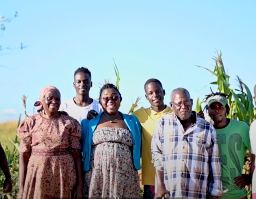 Esnath Divasoni with her family and other community members in Marondera