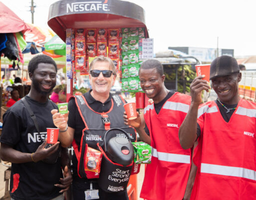 Rabie Issa, Business Executive Officer, Nestlé Professional and Nestlé Waters flanked by coffee sellers in Accra