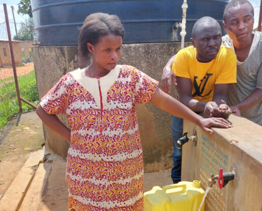 Esther Mukantwali at a water point in Rwangara village