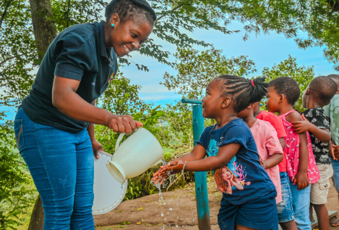 Early-Learning-Development-Vukuzenzele-Fun-Foundation-Grade-000-Washing-Hands-Using-Water-From-Thanda-Tank