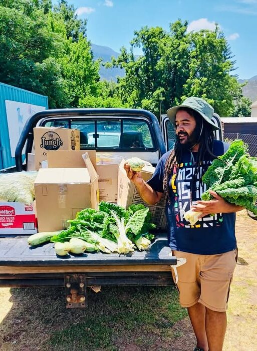Marshall Rinquest admiring his veggies